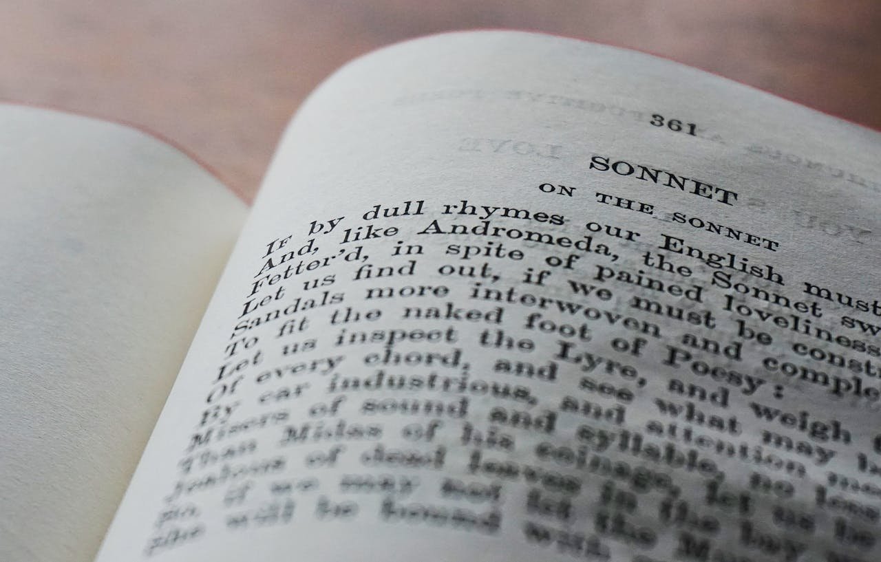 about-02 Close-up of an open book page displaying a classic English sonnet in black and white.